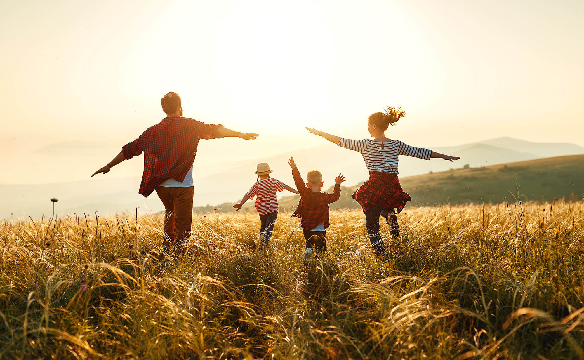 Happy family on sunset